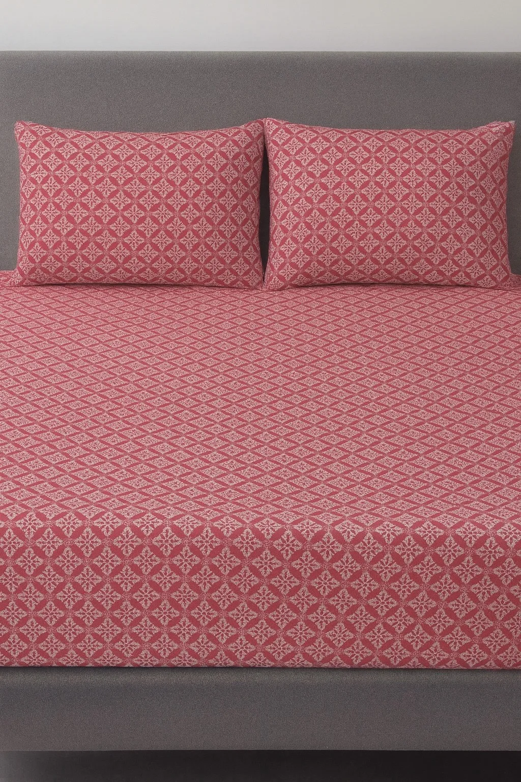 Botanica12 Elegant red bedsheet fabric with subtle pattern – Themes Furnishings