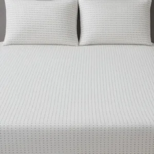 Textured white bedsheet fabric with subtle pattern – Themes Furnishings
